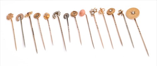 Lot 606 - A collection of stick pins including examples...