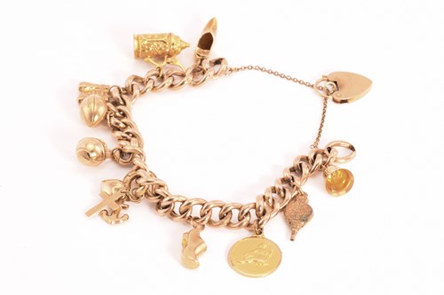 Lot 72 - A 9ct gold charm bracelet, consisting of a...