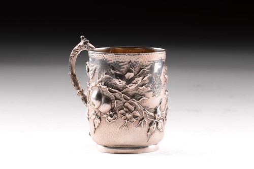 Lot 271 - An Edwardian silver christening mug, decorated...