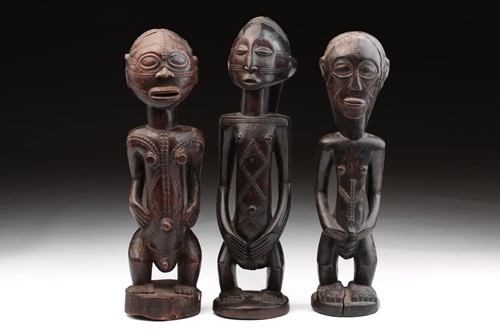 Lot 7 - Two Tabwa standing female figures and a male...