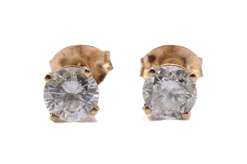 Lot 101 - A pair of diamond ear studs, each comprises a...