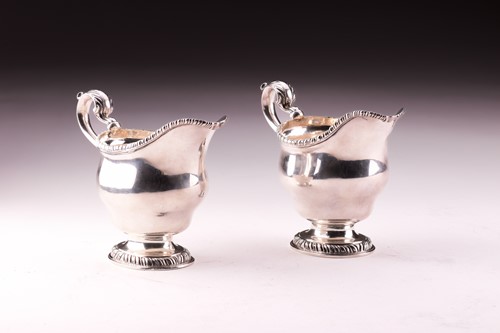 Lot 283 - A pair of George II silver sauce boats, with...