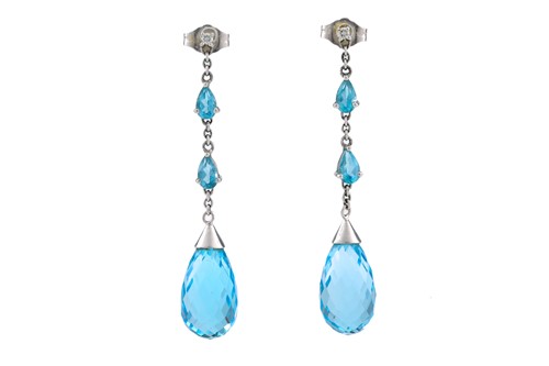Lot 64 - A pair of blue topaz drop earrings in 9ct...