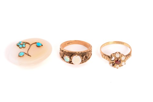 Lot 128 - Two 9ct gold gem-set rings and a white agate...