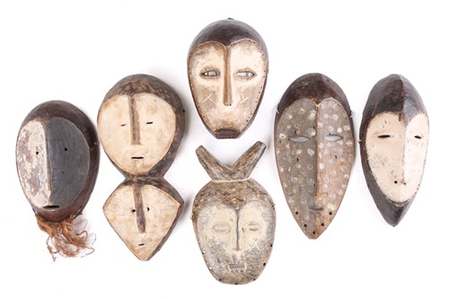 Lot 24 - A hand held Lega mask, Lukwakongo, the face...