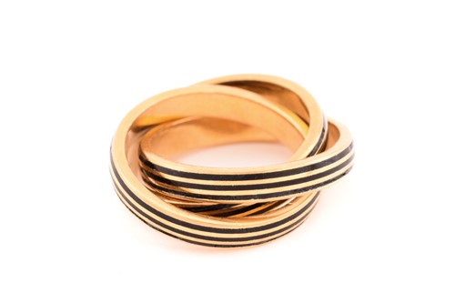 Lot 85 - An enamelled trinity ring, with three...