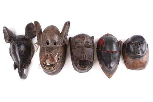 Lot 38 - A collection of zoomorphic masks, to include...