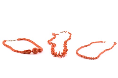 Lot 122 - Three coral beaded necklaces; to include one...