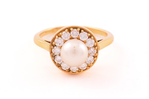 Lot 6 - A pearl and diamond entourage ring in 18ct...