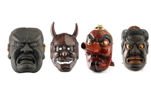 Lot 147 - A collection of four Japanese carved wood...