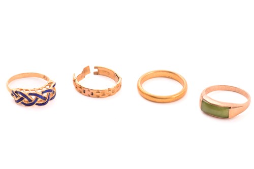 Lot 51 - A 22ct gold wedding band and three other rings;...