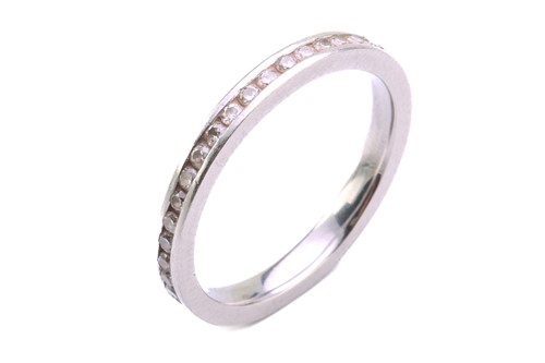 Lot 153 - A diamond eternity ring, comprises an array of...