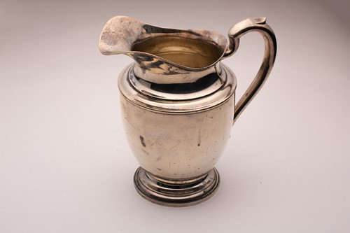 Lot 456 - An American ewer of tapering circular baluster...