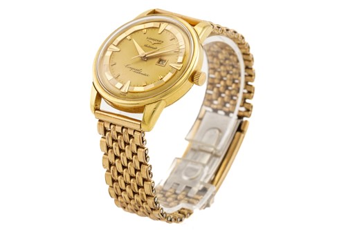 Lot 304 - A Longines automatic conquest calendar...