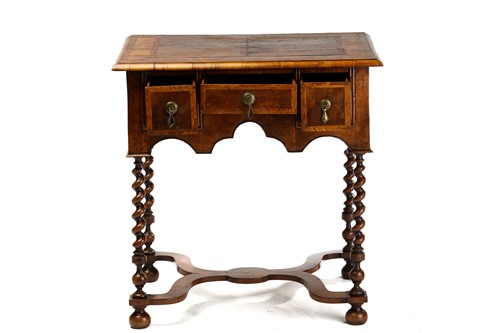 Lot 220 - A William & Mary walnut kneehole lowboy, the...
