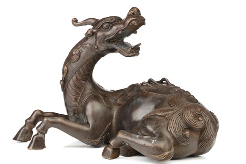 Lot 106 - A Chinese bronze figure of a recumbent Pixiu,...