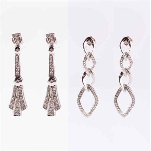 Lot 634 - A pair of 9ct white gold and diamond earrings...