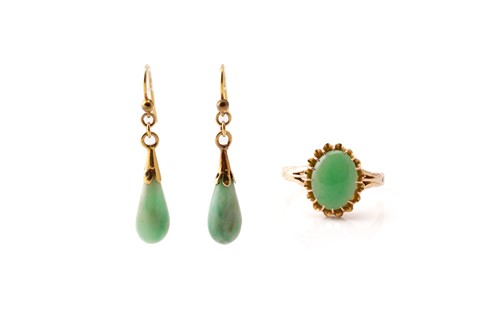 Lot 215 - A jade ring and a pair of drop earrings; the...