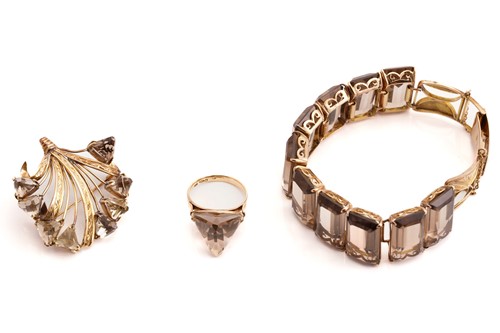 Lot 139 - A smoky quartz bracelet, a brooch and matching...