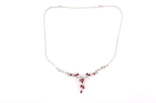 Lot 88 - A ruby and diamond necklace, claw set with...