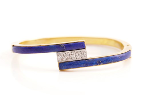 Lot 153 - A lapis lazuli and diamond hinged bangle, half...