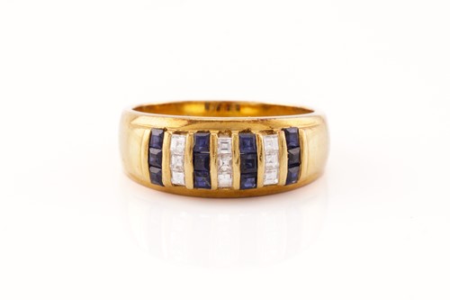 Lot 35 - A diamond and sapphire dress ring of stripe...