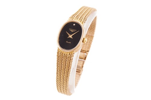 Lot 380 - A lady's Longines dress watch, featuring a...
