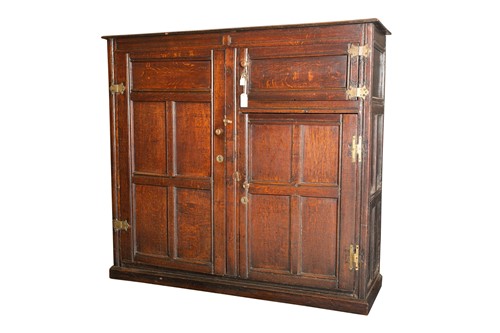Lot 278 - An 18th oak Wainscott cupboard with a planked...