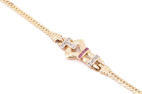 Lot 202 - A buckle bracelet set with diamonds and rubies,...