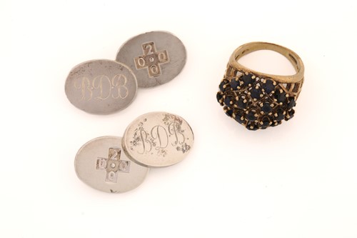 Lot 205 - A pair of silver cufflinks and a sapphire...