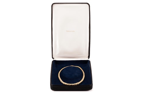 Lot 30 - Tiffany & Co. - A graduated wheat necklace in...