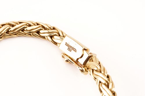 Lot 30 - Tiffany & Co. - A graduated wheat necklace in...