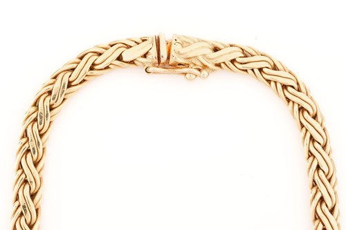 Lot 30 - Tiffany & Co. - A graduated wheat necklace in...