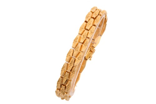 Lot 125 - A three-row brick link bracelet, composed of...