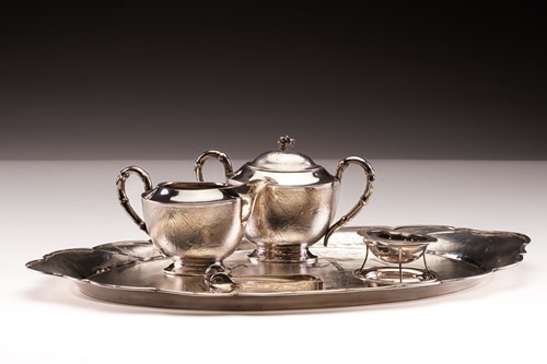 Lot 454 - A Chinese white metal tea tray; shaped oval,...