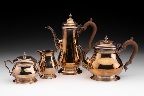 Lot 383 - A 20th century four-piece silver tea set in...