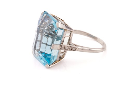 Lot 140 - A large aquamarine dress ring, featuring an...