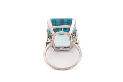 Lot 140 - A large aquamarine dress ring, featuring an...