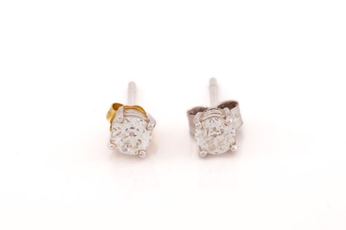 Lot 55 - A pair of diamond stud earrings in 18ct white...