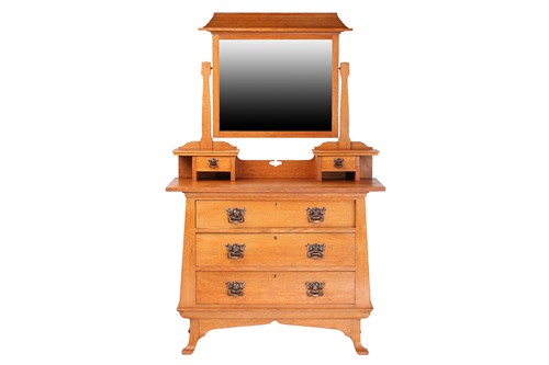 Lot 12 - An early 20th century Arts & Crafts golden oak...