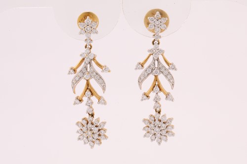 Lot 83 - A pair of diamond pendant earrings, each has...