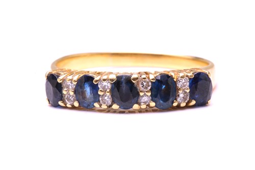 Lot 162 - A sapphire and diamond half hoop ring,...