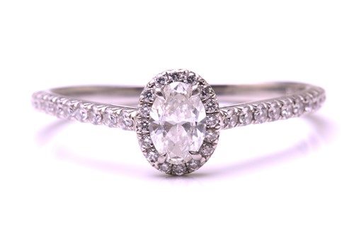 Lot 259 - A Tiffany & co. diamond set halo ring,...