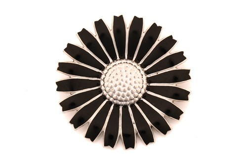 Lot 27 - Georg Jensen - A black enamelled daisy brooch...