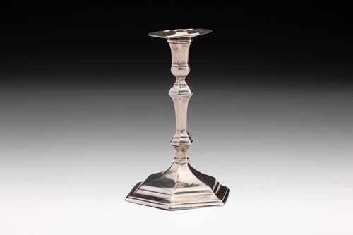 Lot 446 - A George I taper stick; octagonal with...