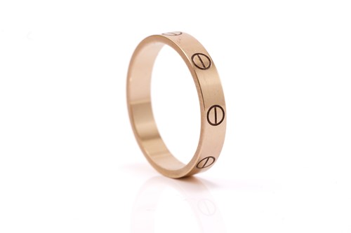 Lot 18 - Cartier 'Love' ring. The polished 18 carat...