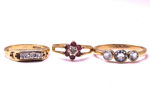 Lot 149 - A three stone half hoop aquamarine ring, the...