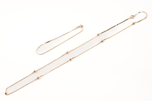 Lot 45 - A herringbone link bracelet and a serpent link...
