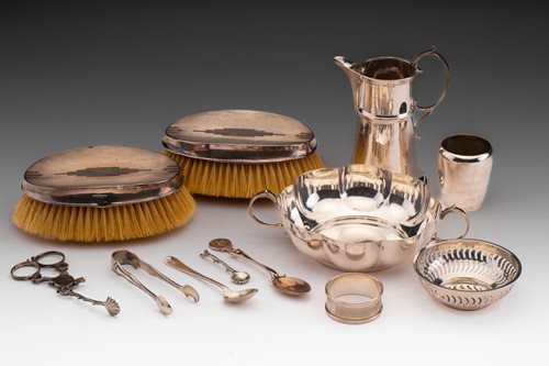 Lot 421 - A silver milk jug; flared cylindrical with...