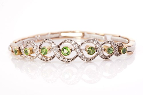 Lot 111 - A demantoid garnet and diamond bracelet,...